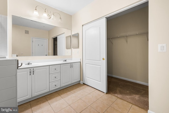 bathroom with vanity and tile patterned flooring