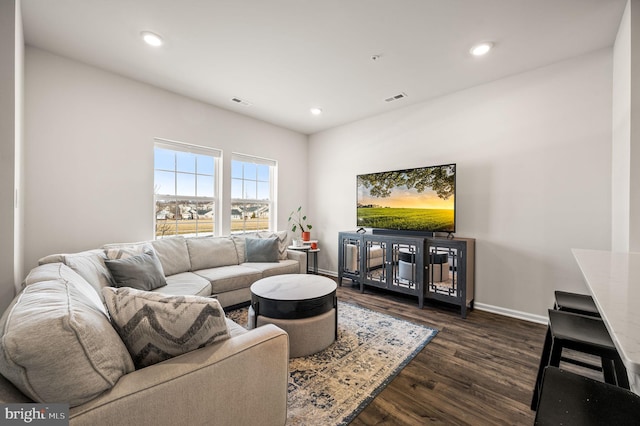 living room with dark hardwood / wood-style floors