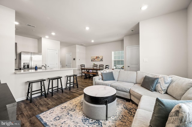 living room featuring dark hardwood / wood-style floors