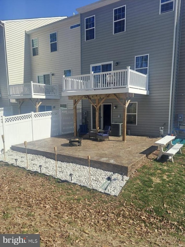 back of house with cooling unit and a patio area