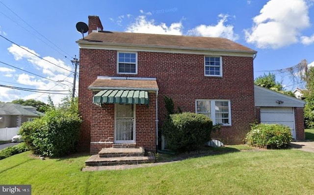 view of front of property featuring a garage and a front lawn