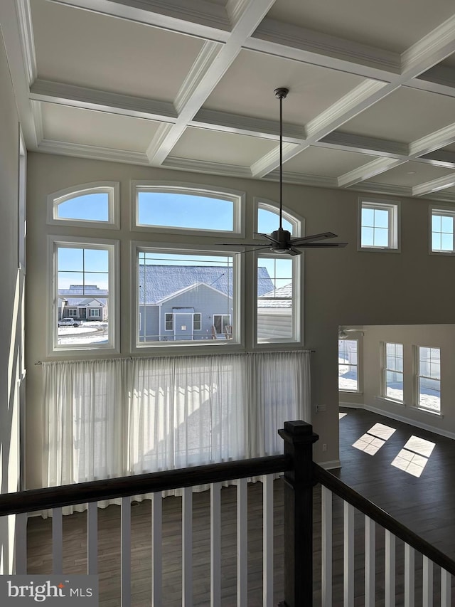 room details with ceiling fan, ornamental molding, beamed ceiling, and coffered ceiling