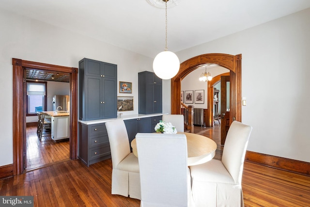 dining area with dark hardwood / wood-style flooring