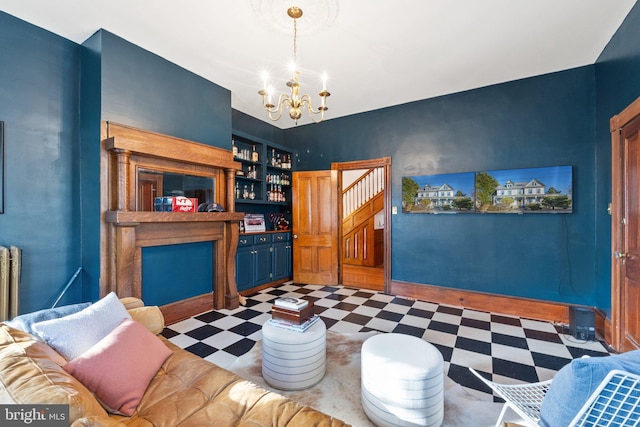 living room with bar and a notable chandelier