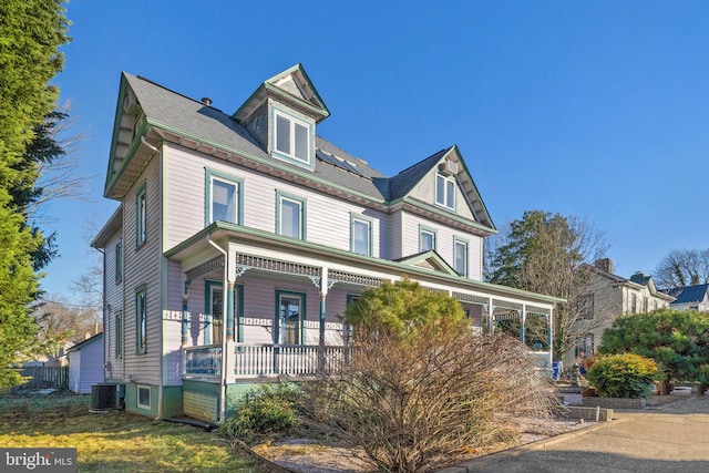 view of front of home with central air condition unit and a porch