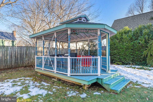 snow covered deck featuring a gazebo