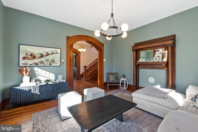 living room featuring hardwood / wood-style floors and a chandelier