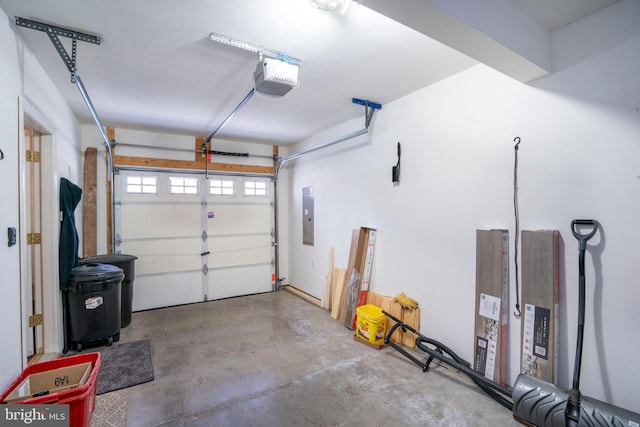 garage featuring a garage door opener and electric panel