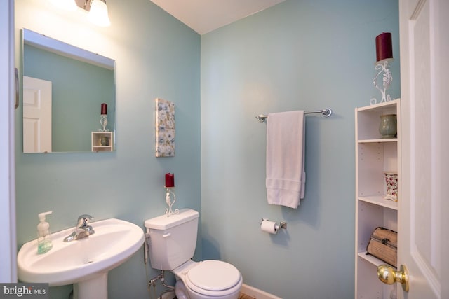 bathroom with toilet and sink