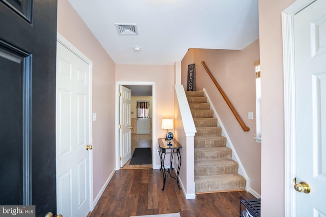 foyer featuring dark wood-type flooring