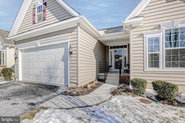 view of exterior entry featuring a garage