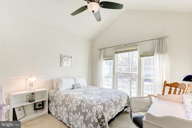 carpeted bedroom featuring ceiling fan and lofted ceiling