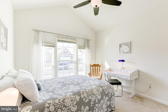 bedroom featuring ceiling fan, lofted ceiling, and light carpet