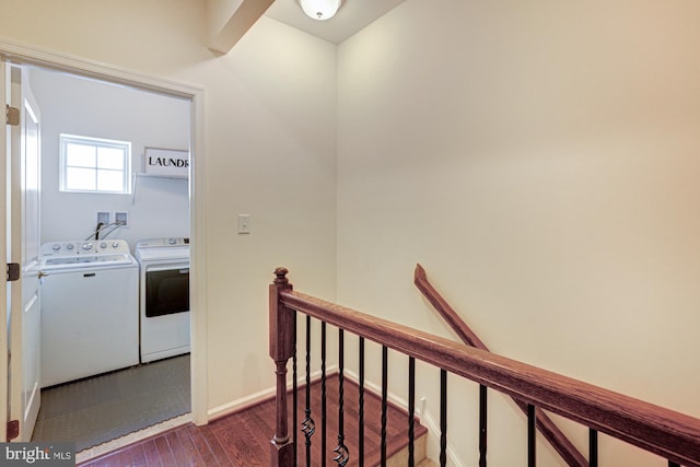 corridor featuring washer and clothes dryer and dark wood-type flooring