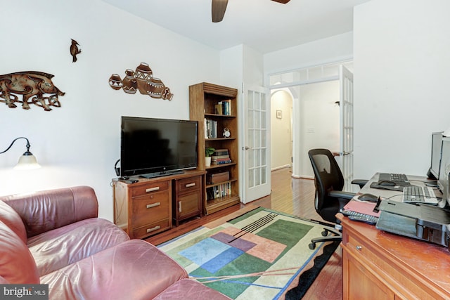 office featuring light hardwood / wood-style floors and ceiling fan