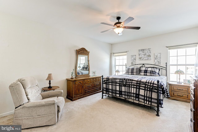 bedroom featuring ceiling fan and light carpet