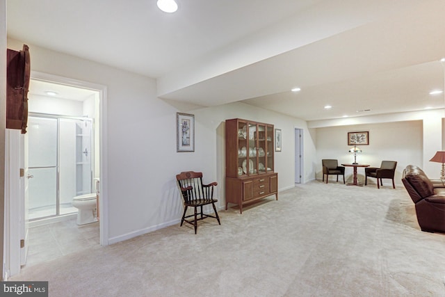 living area with light carpet