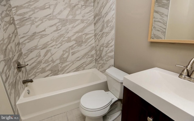 full bathroom with toilet, tiled shower / bath, tile patterned floors, and vanity