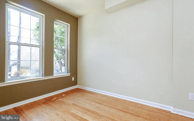 empty room featuring wood-type flooring