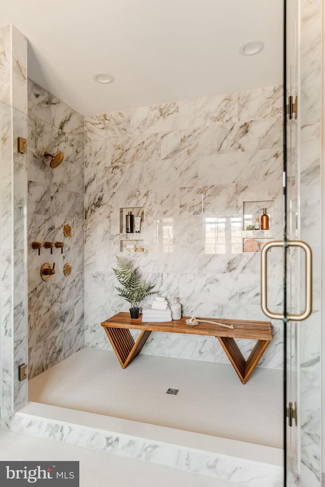 bathroom featuring an enclosed shower