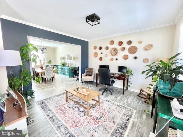 office with wood-type flooring, ornamental molding, and a chandelier