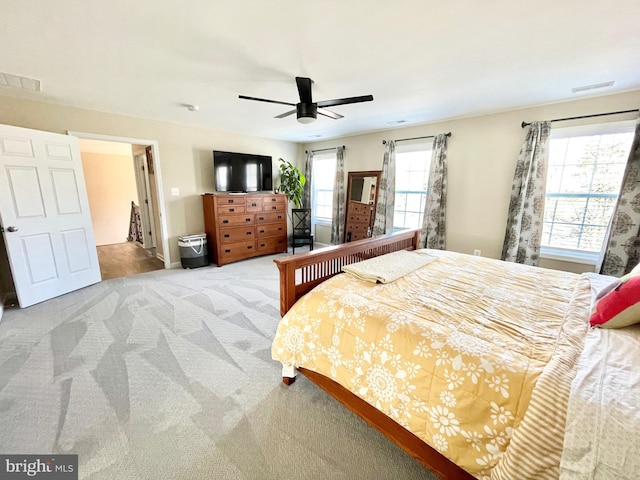 carpeted bedroom with ceiling fan