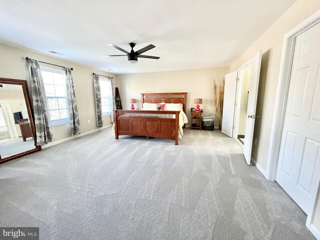 carpeted bedroom featuring ceiling fan