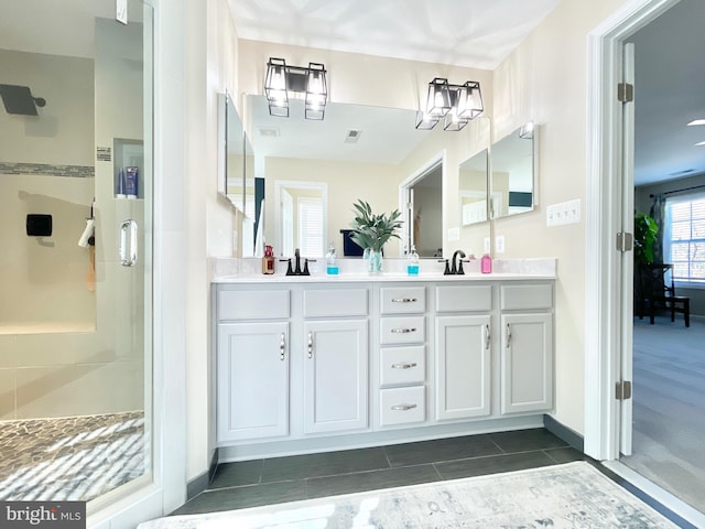 bathroom with vanity and an enclosed shower