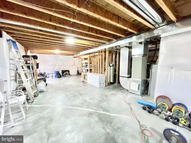 basement featuring heating unit