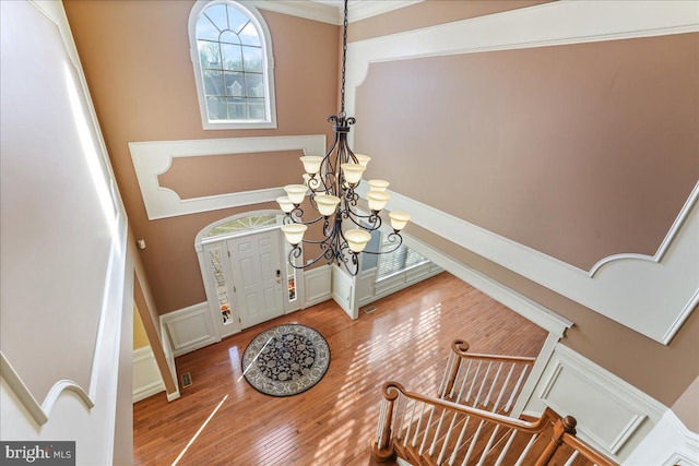 foyer featuring a chandelier and hardwood / wood-style flooring