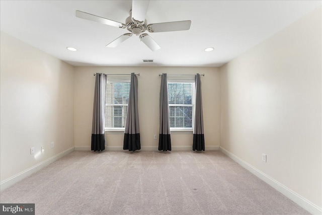 carpeted empty room featuring ceiling fan