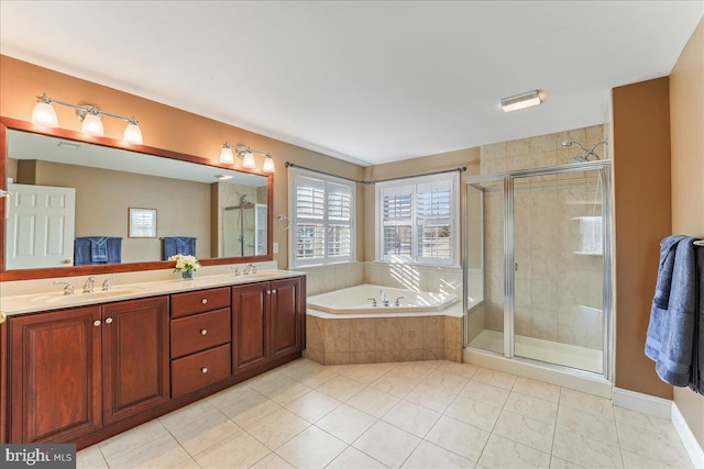 bathroom with vanity, tile patterned floors, and plus walk in shower