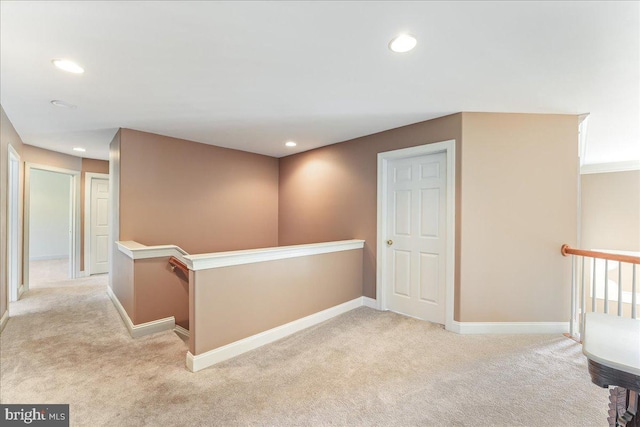 hallway with light carpet