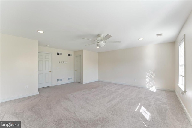 carpeted empty room with ceiling fan