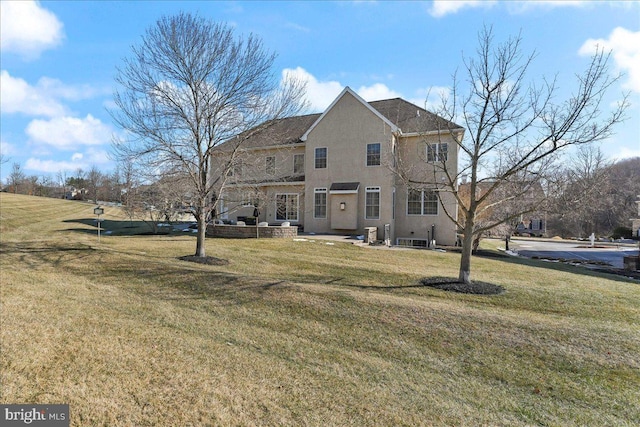 back of house with a yard