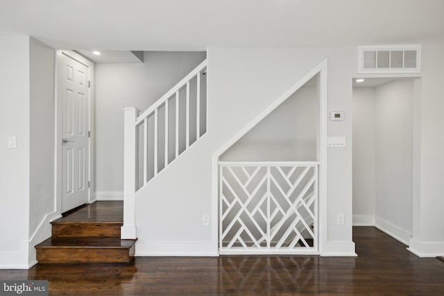 staircase featuring hardwood / wood-style flooring