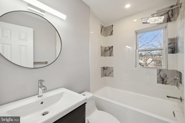 full bathroom featuring vanity, toilet, and tiled shower / bath