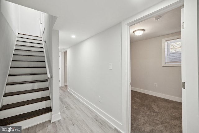 staircase featuring hardwood / wood-style floors