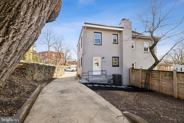 back of property with central AC unit