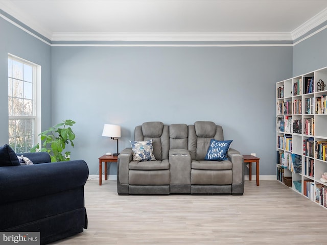 living room with crown molding and light wood-type flooring