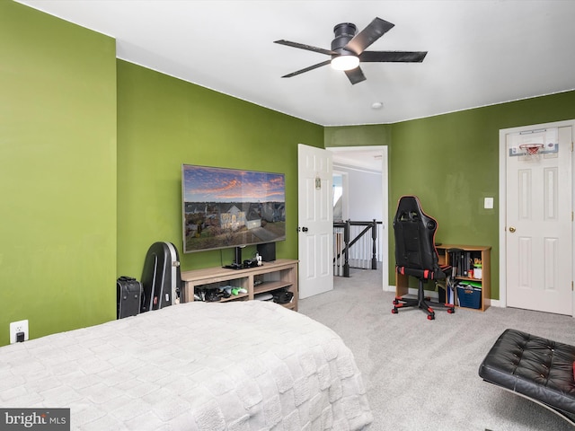 bedroom with ceiling fan and light carpet