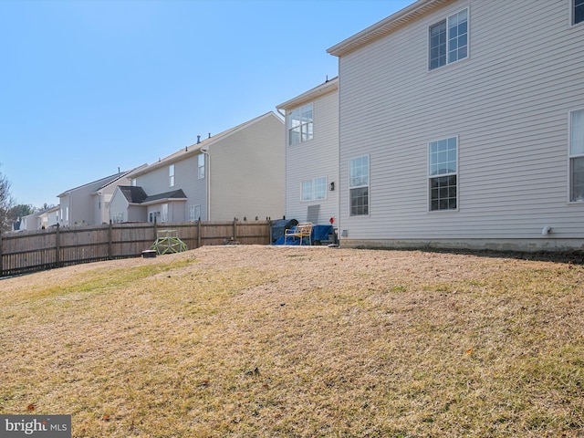 back of property featuring a yard