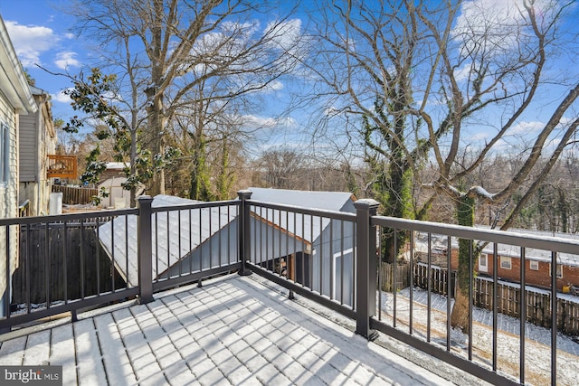 view of snow covered deck