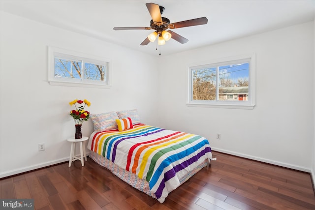 bedroom featuring ceiling fan and dark hardwood / wood-style floors