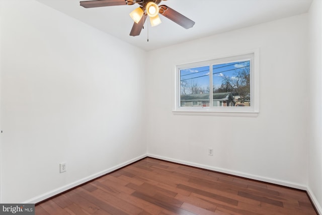 empty room featuring ceiling fan and hardwood / wood-style floors