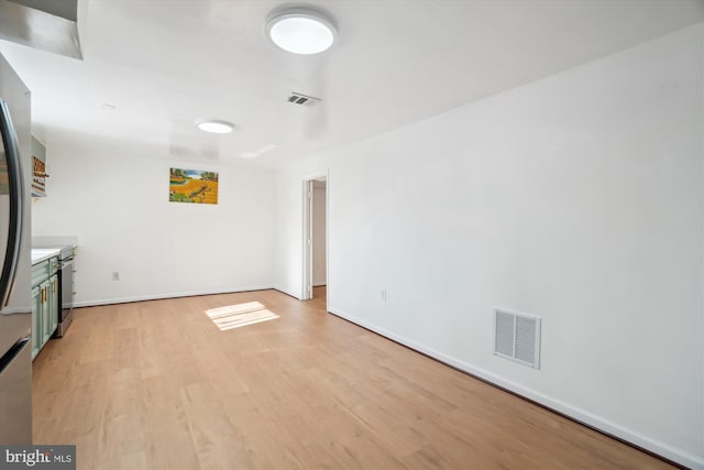 unfurnished living room with light wood-type flooring