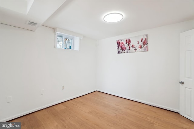 basement featuring hardwood / wood-style flooring