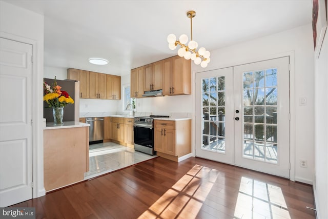 kitchen with hardwood / wood-style floors, appliances with stainless steel finishes, light brown cabinetry, french doors, and pendant lighting