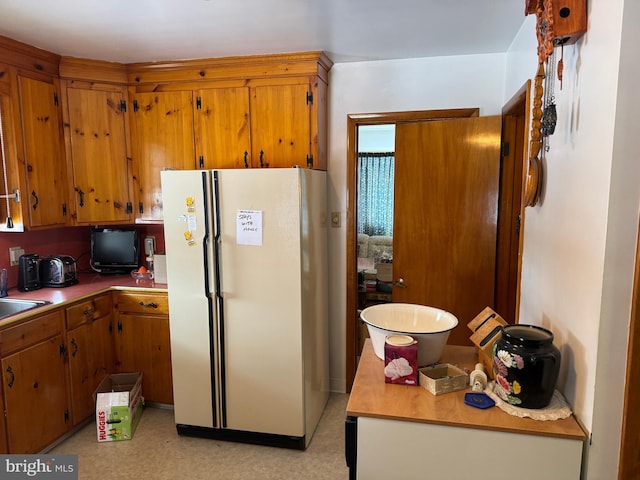 kitchen with sink and white refrigerator