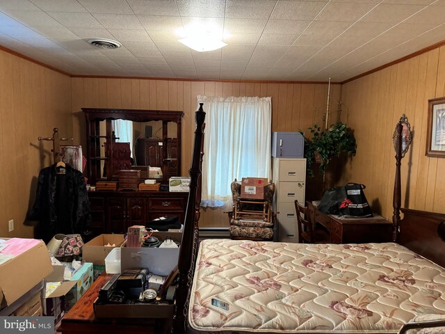 bedroom with wooden walls